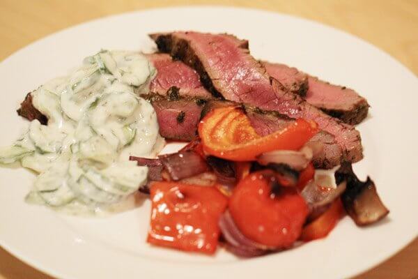 Grilled flank steak with cucumber-yogurt sauce and roasted red peppers, red onions and portobello mushrooms