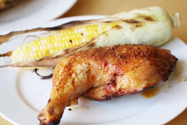 Grilled butterflied chicken with a chile-cinnamon rub and grilled corn on the cob