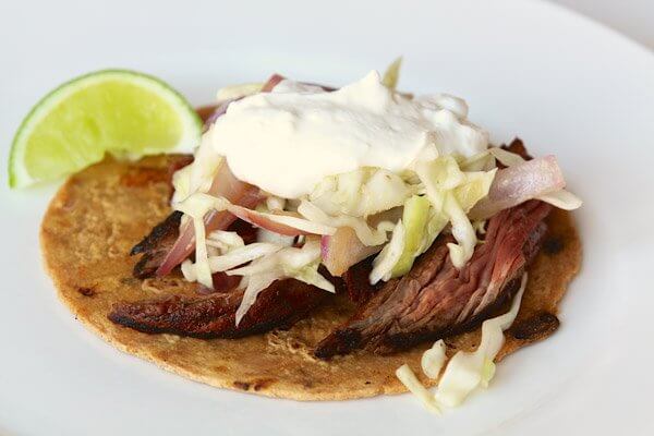 Flank steak tacos with spicy slaw
