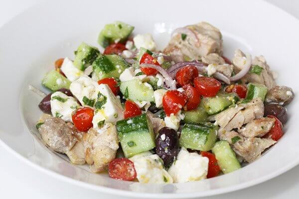 Village-style Greek salad with chicken, cucumber, cherry tomatoes, feta cheese, olives and lemon-mint vinaigrette