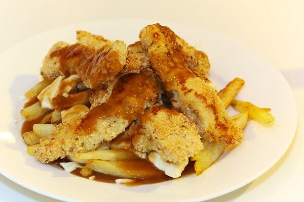 Homemade poutine with chicken fingers